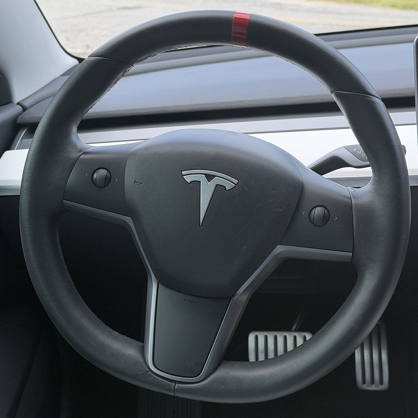 The steering wheel of a Tesla Model 3